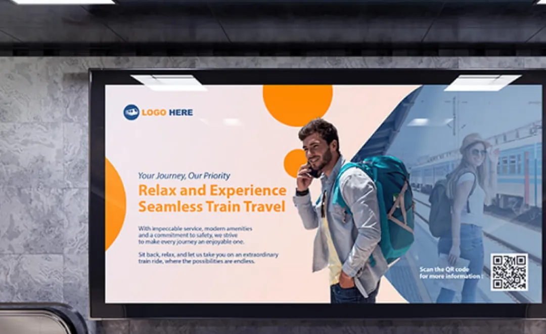 A train travel advert on a large screen in a station.