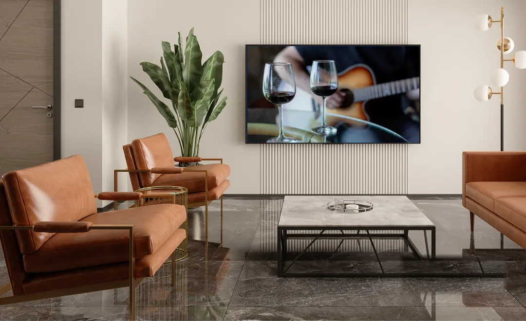 A music video on the TV of a hotel lounge.